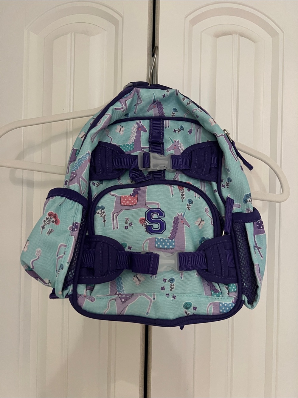 Monogrammed Letter S Kids Unicorn Print Mini Backpack in Light Blue and Purple.
